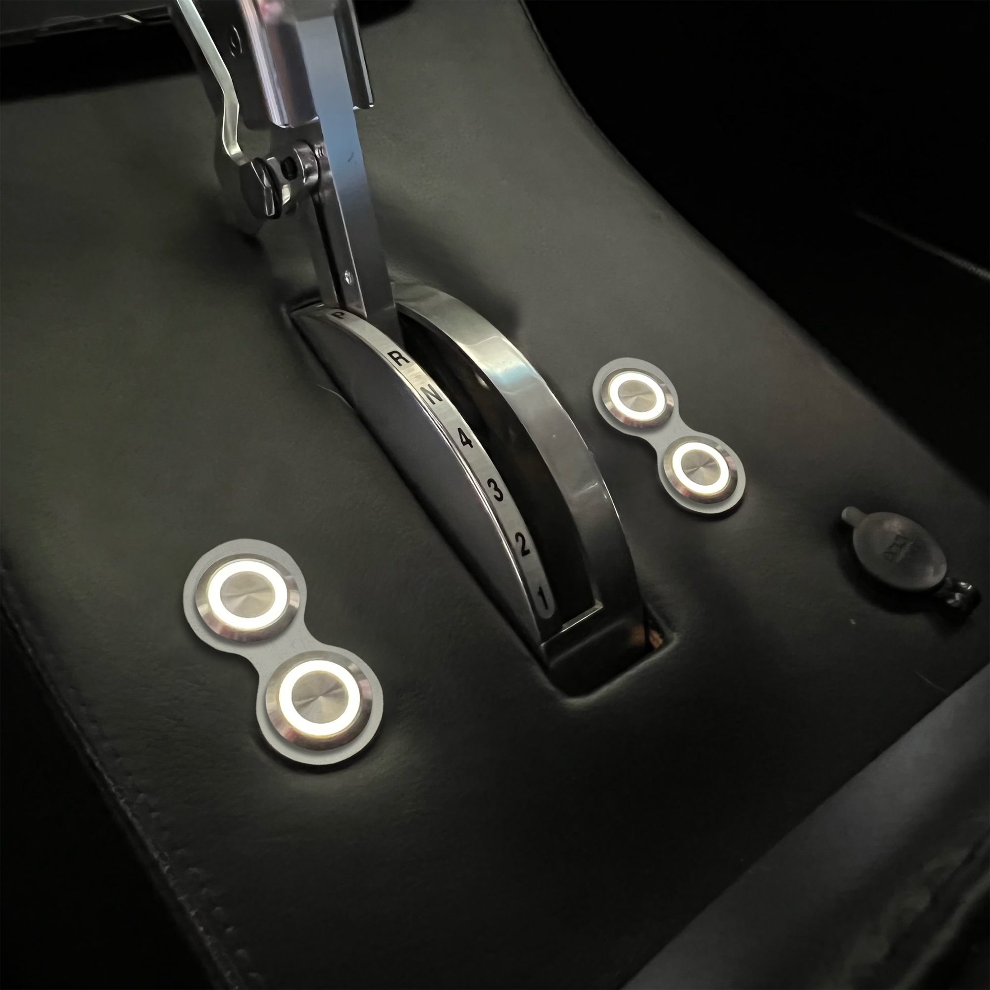 Retro Billet Switches with White Illumination Installed in Center Console