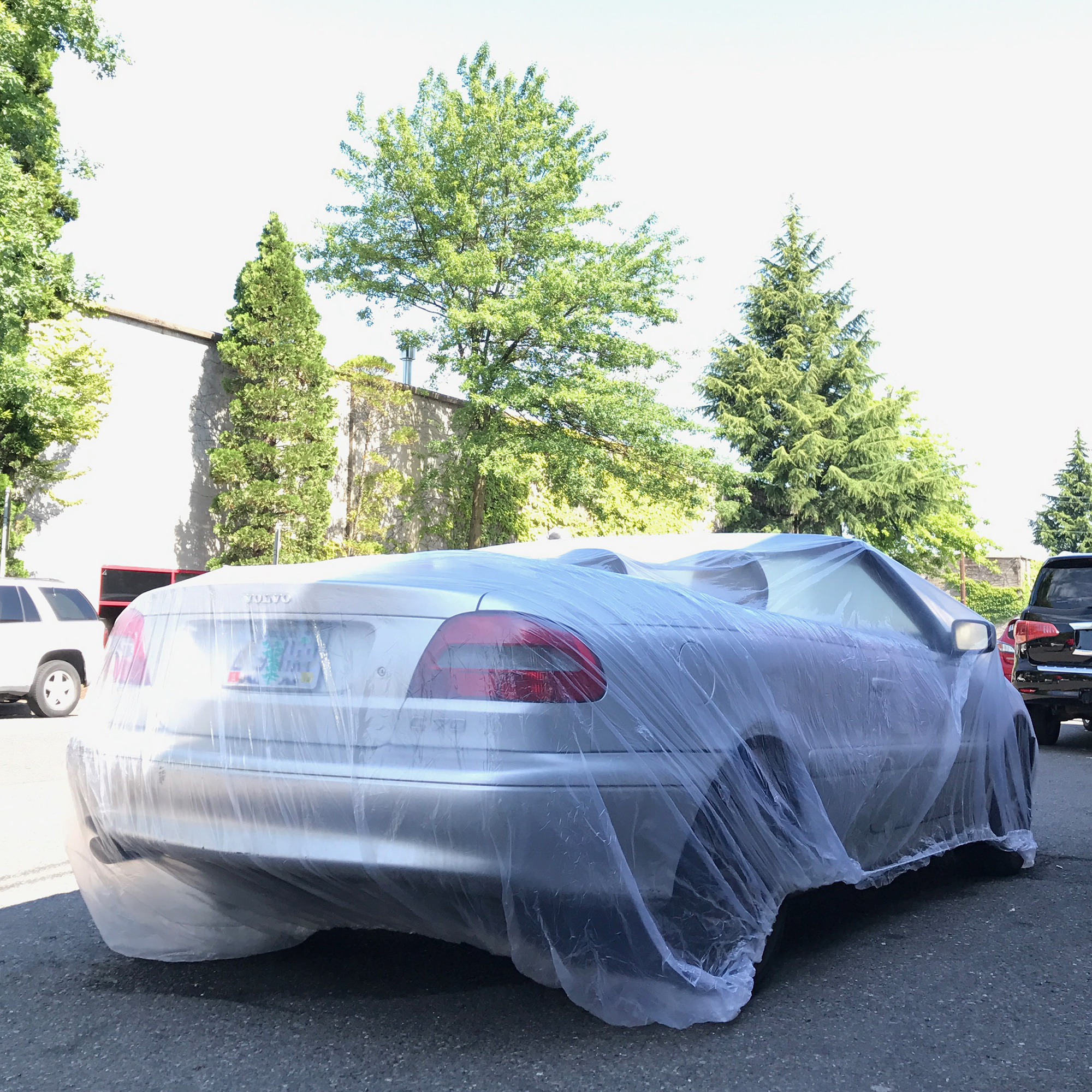 Car Cover Over a Convertible In The Street